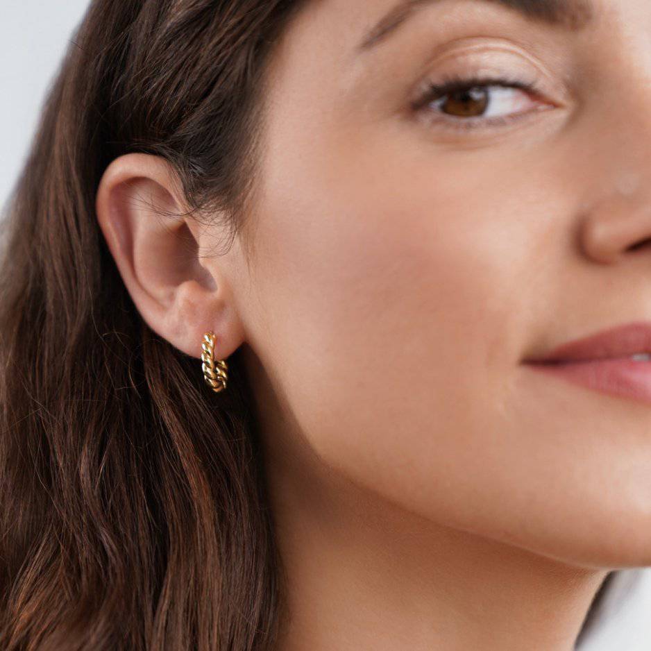 Gold twist earrings from Emma & Rose Cape Town's Krystal™ Stylish Twist Earrings collection, featuring a sleek, modern design.