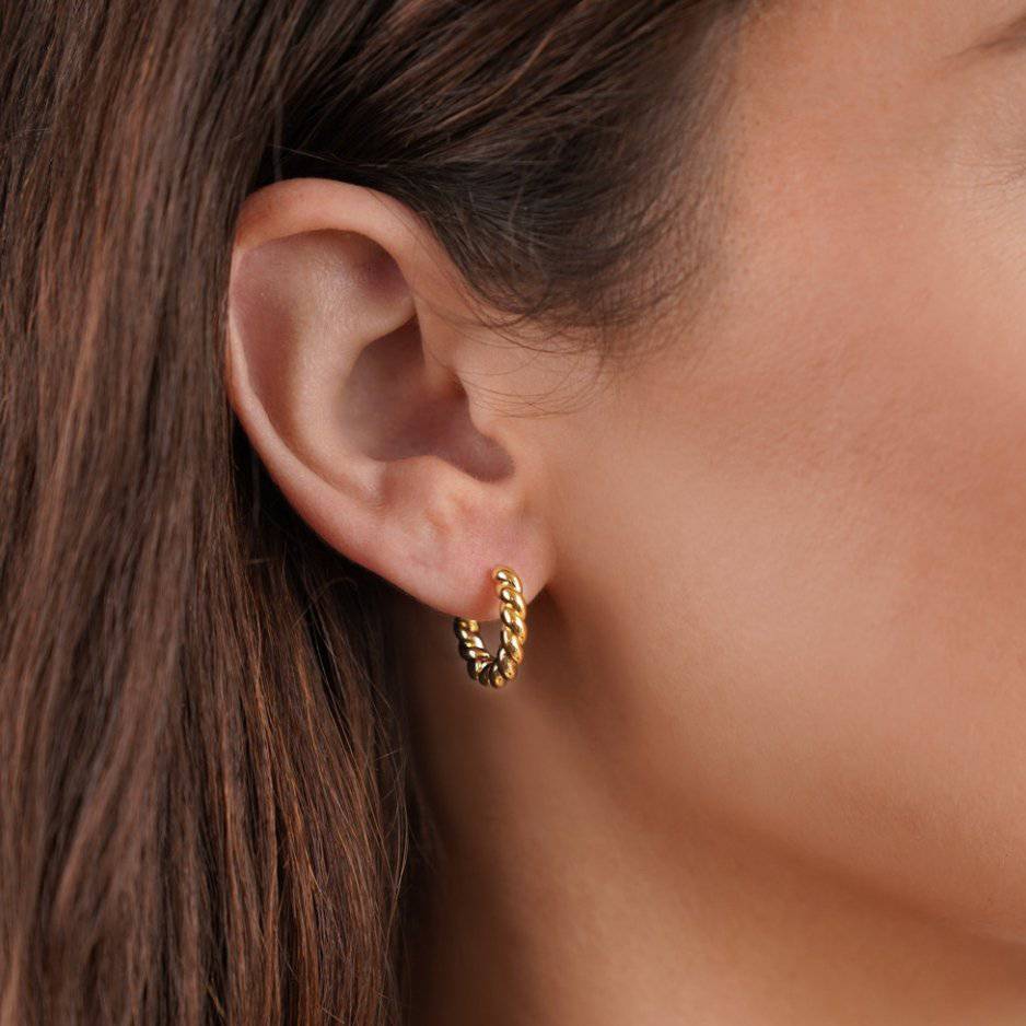 Gold twist earrings from Emma & Rose Cape Town's Krystal™ Stylish Twist Earrings collection, featuring elegant, intertwined design.