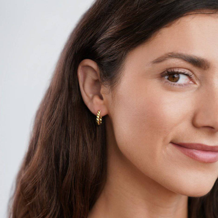 Gold Twist Earrings from Emma & Rose Cape Town, stylish Krystal™ jewelry, featuring elegant twisted design and shiny finish.