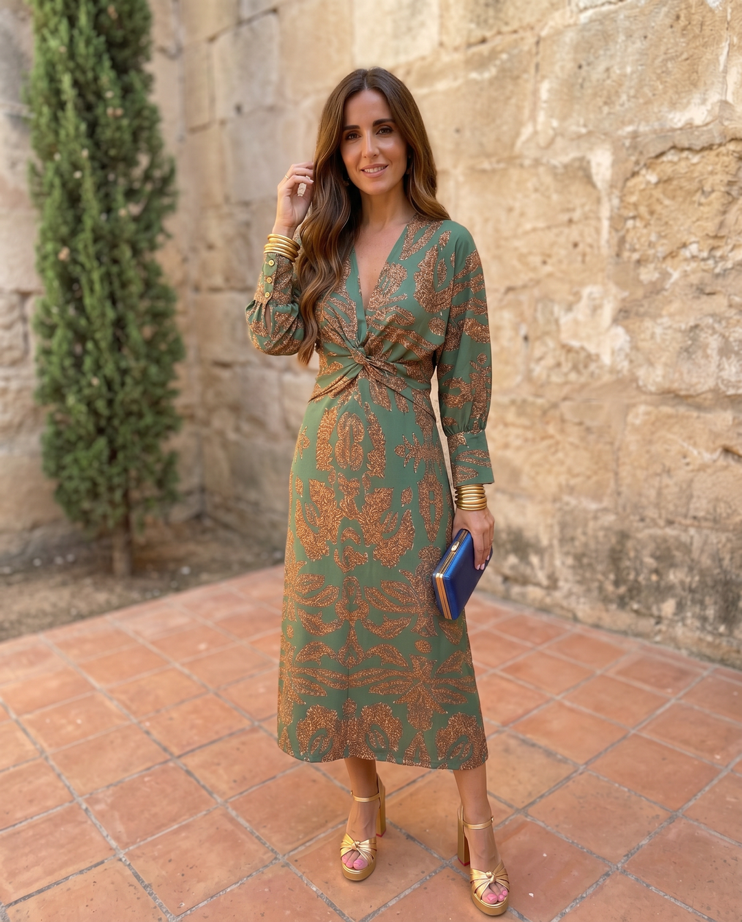 Silvia™ midi dress with vibrant print by Emma & Rose Cape Town, shown in a candid fashion photograph on a model.