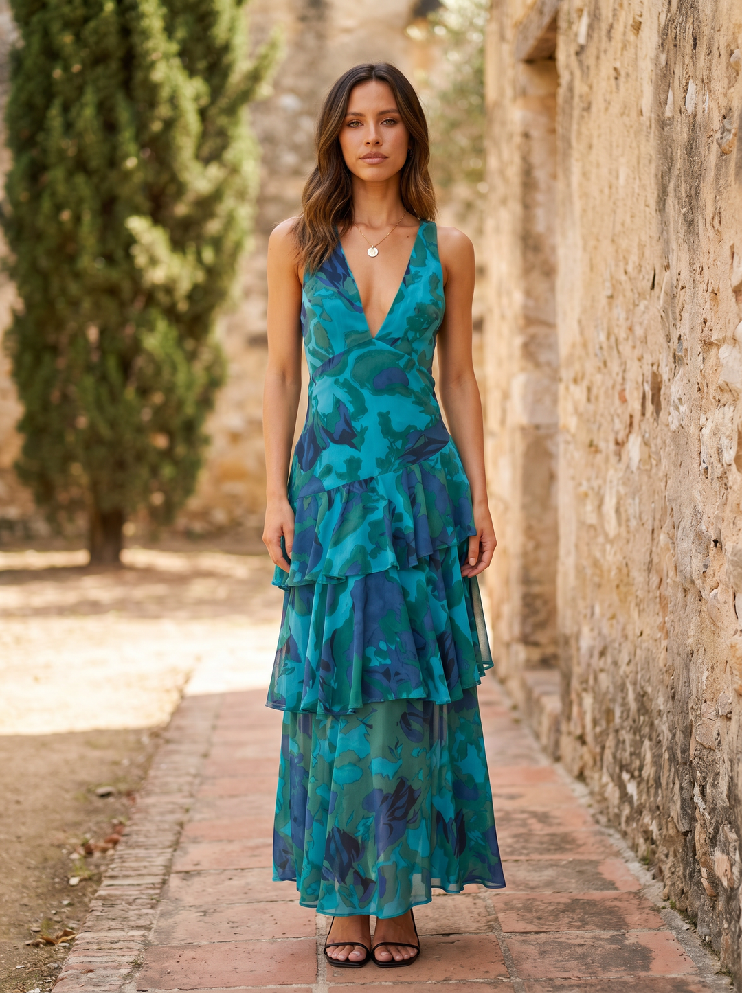 Floral print dress with deep V-neck from Emma & Rose Cape Town, featuring a flowing fabric and vibrant floral pattern.