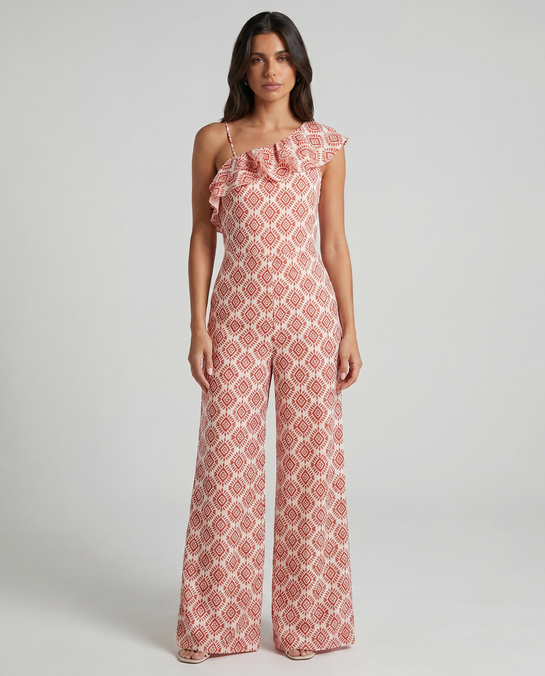 Jimena spring geometric print jumpsuit by Emma & Rose Cape Town, showcasing the stylish, fitted design with vibrant pattern.