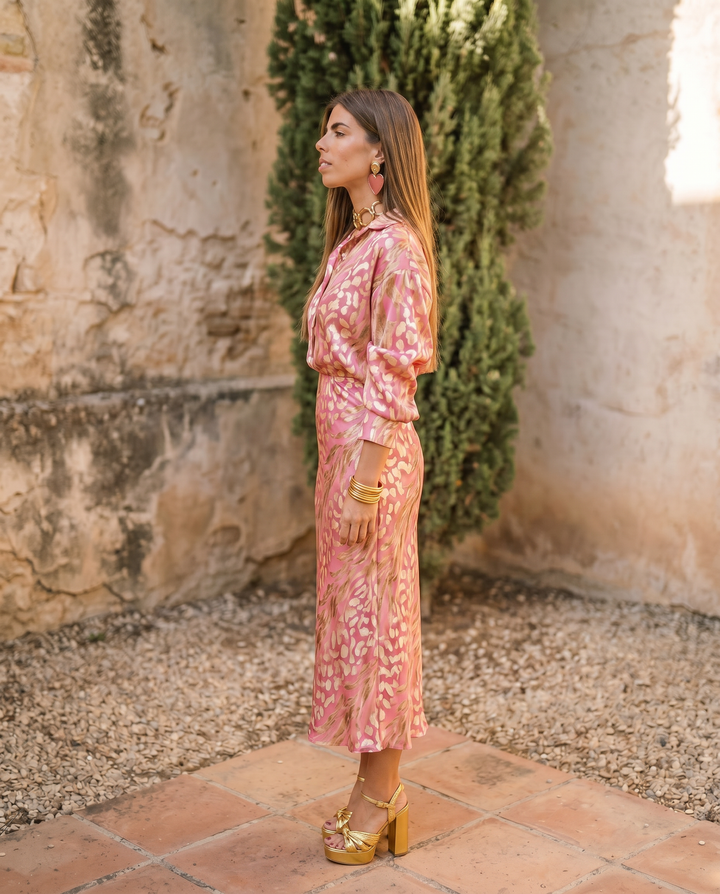 Elegant two-piece event dress by Emma & Rose Cape Town featuring a flowing skirt and fitted bodice, in a sleek, photorealistic style.