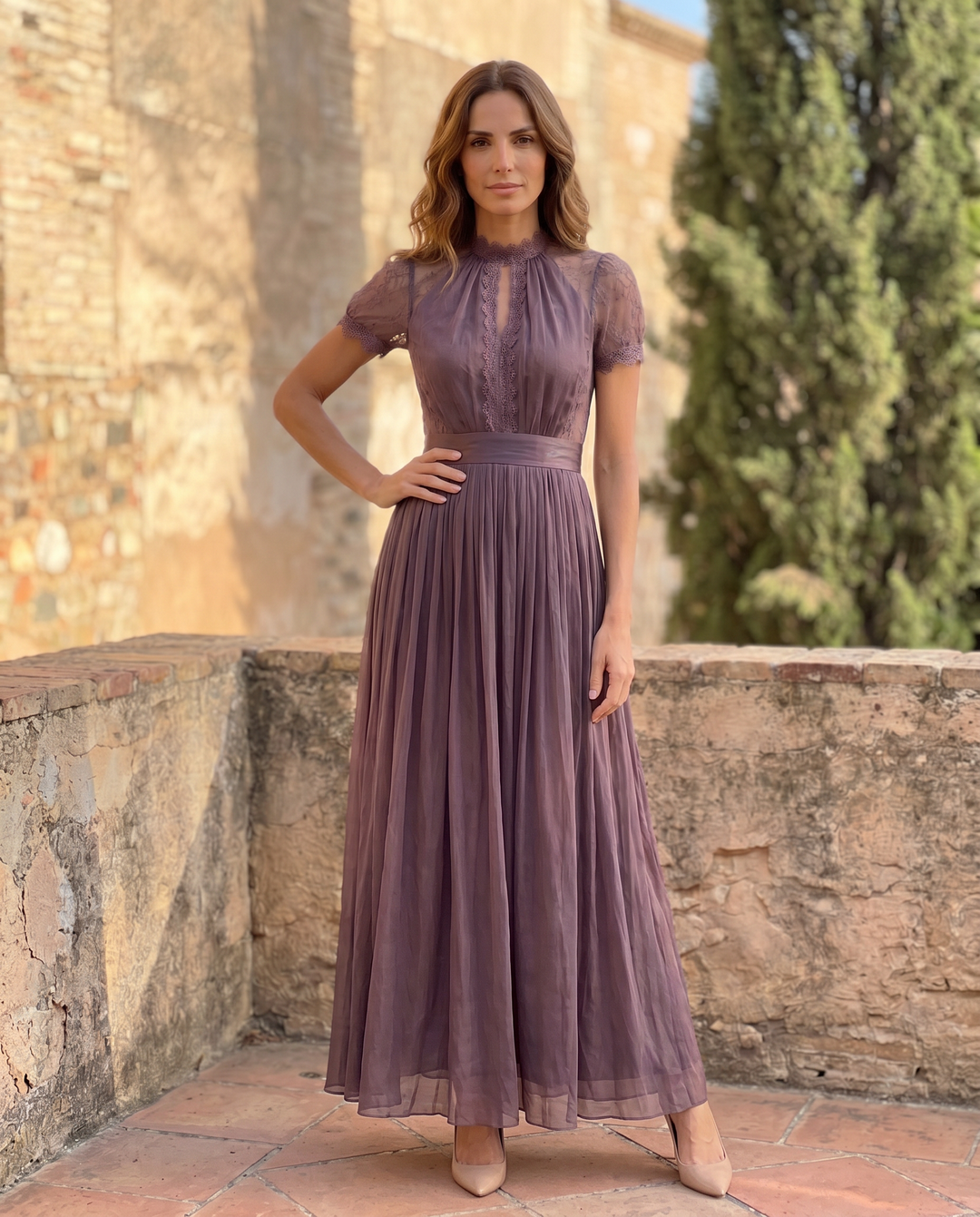Long purple chiffon dress with keyhole neckline and lace trim by Emma & Rose Cape Town, shown on a model.