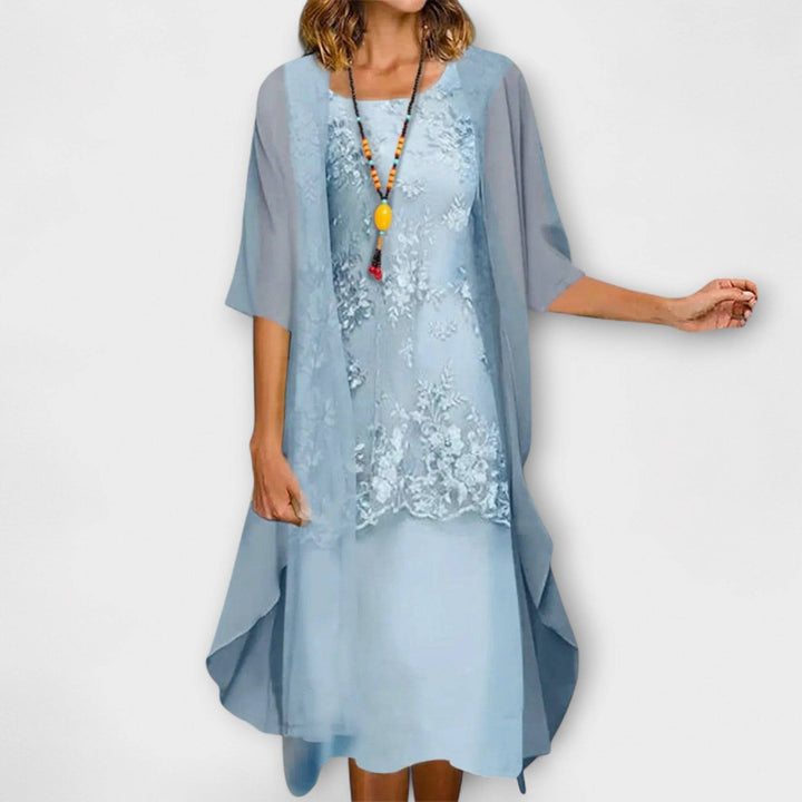 Penliah™ elegant dress by Emma & Rose Cape Town, featuring a stylish, flowing design with intricate detailing, displayed on a mannequin.