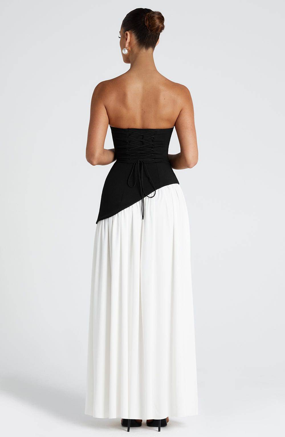 Black and white Marisela™ Maxi Dress by Emma & Rose Cape Town, featuring elegant flowing fabric and a sophisticated design.