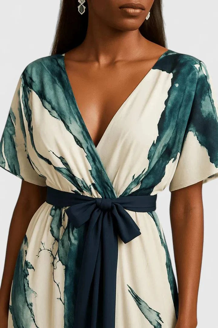 Long watercolor print dress by Emma & Rose Cape Town featuring a sophisticated design and elegant fit.