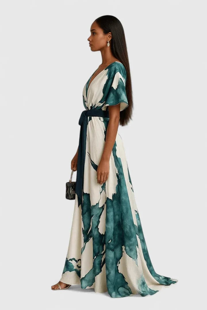 Long watercolor print dress by Emma & Rose Cape Town, featuring elegant design and sophisticated style.