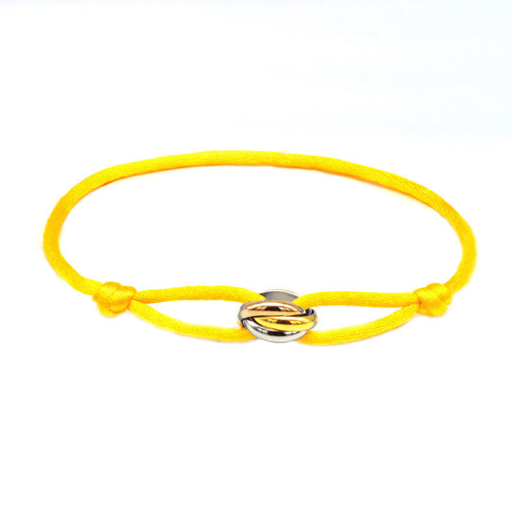 Emma & Rose Manhattan Ryan Golden Trifecta Bracelet featuring layered gold chains and elegant design on a neutral background.