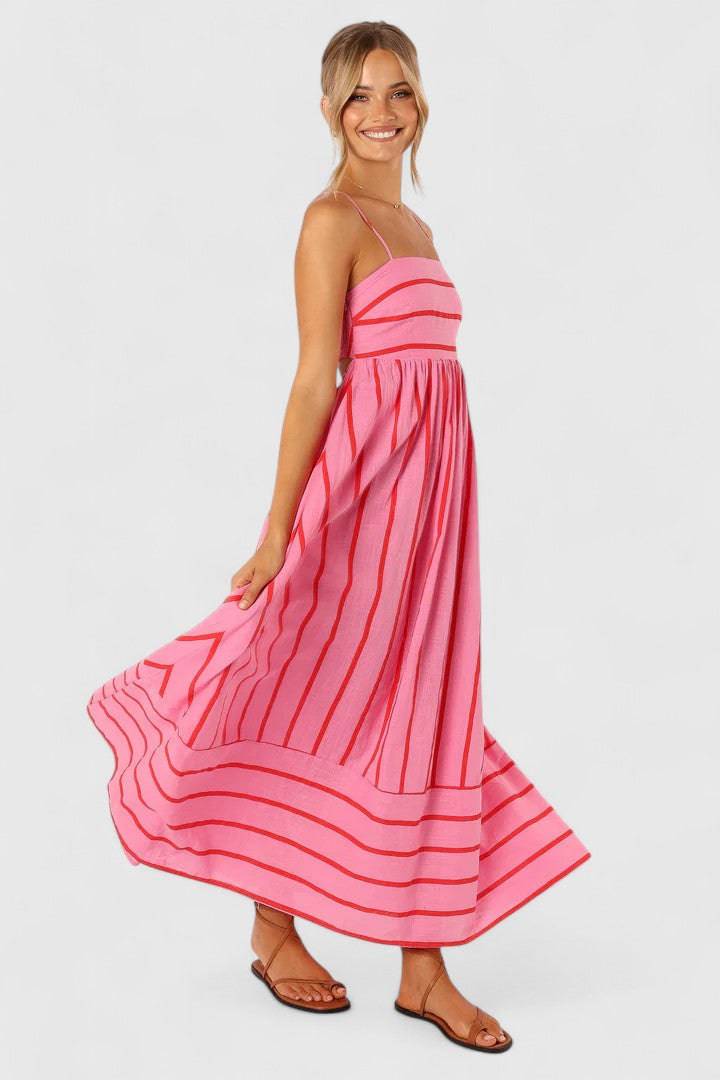 Pink and red Ilyanthe™ maxi dress by Emma & Rose Cape Town featuring petal and pup-inspired design, elegant flowing fabric.