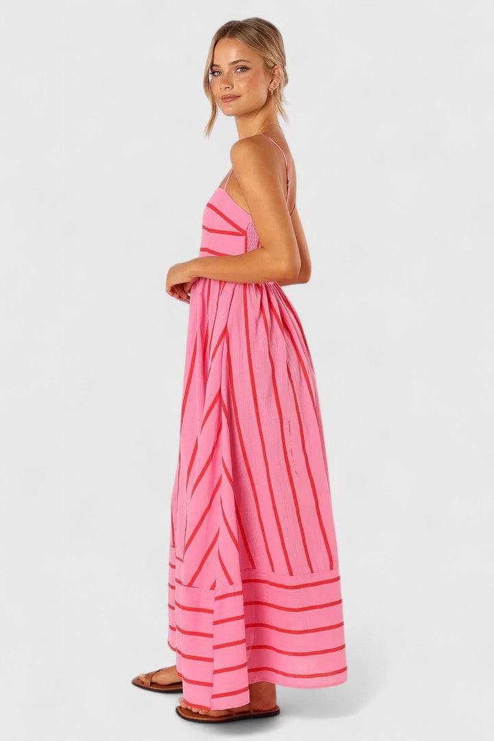 Elegant Ilyanthe™ maxi dress in pink and red with petal and pup details, by Emma & Rose Cape Town.