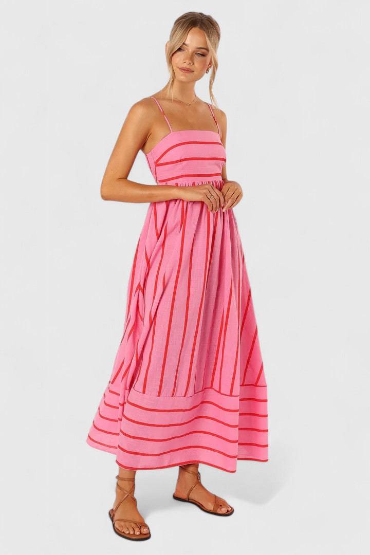 Pink and red Ilyanthe™ maxi dress by Emma & Rose Cape Town featuring elegant petal and pup design, flowing and stylish.