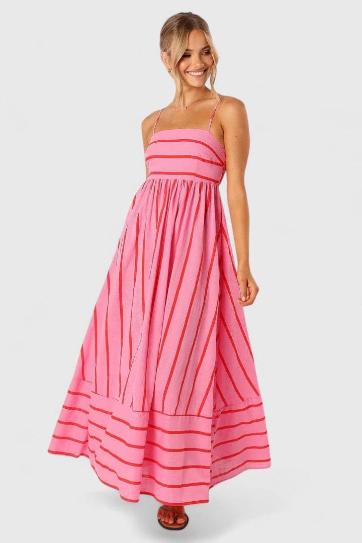 Pink and red Petal and Pup maxi dress by Emma & Rose Cape Town, elegant floral design with flowing fabric.