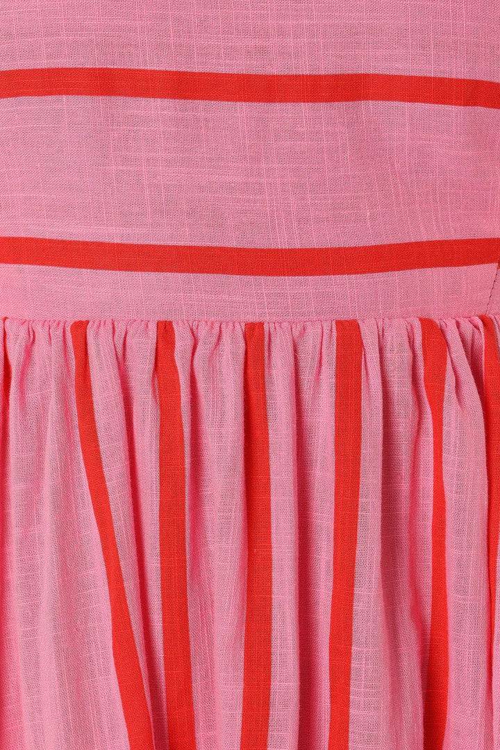 Ilyanthe™ elegant maxi dress by Emma & Rose Cape Town, pink and red petal design, flowing fabric, perfect for formal occasions.