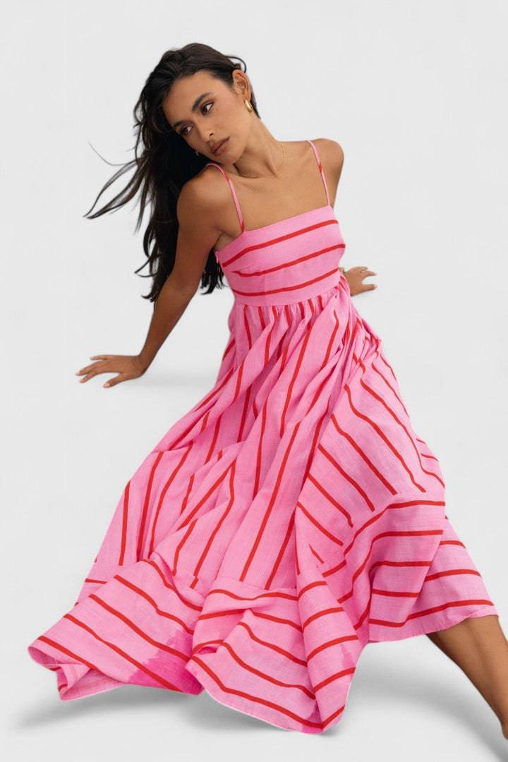 Pink and red Ilyanthe™ Elegant Maxi Dress by Emma & Rose Cape Town, featuring flowy petal-inspired fabric and a stylish design.