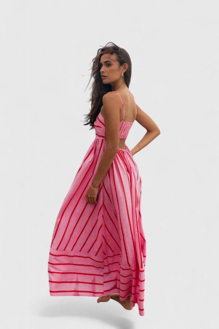Ilyanthe™ elegant pink and red maxi dress by Emma & Rose Cape Town, featuring flowing fabric and floral-inspired design.