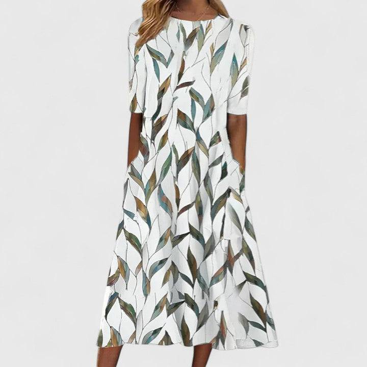 Elegant Sarah™ midi dress by Emma & Rose Cape Town featuring a flowing fabric and stylish silhouette, displayed on a hanger.