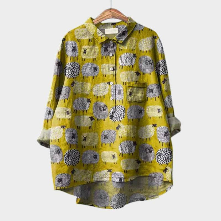Elegant Emma & Rose Cape Town Siara™ blouse with intricate schaap-inspired embroidery, showcasing stylish craftsmanship.