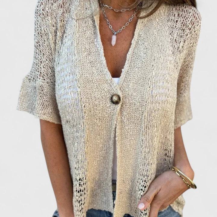 Elegant knitted blouse from Emma & Rose Cape Town’s Calista™ collection, featuring a stylish, textured knit design.