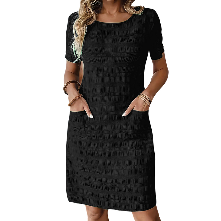 Textured women's dress with pockets and comfortable straight cut
