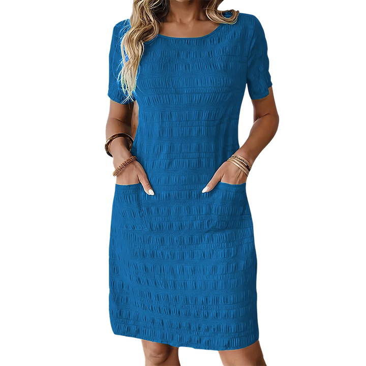 Textured women's dress with pockets and comfortable straight cut