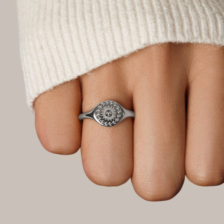 Silver ring with sunburst motif