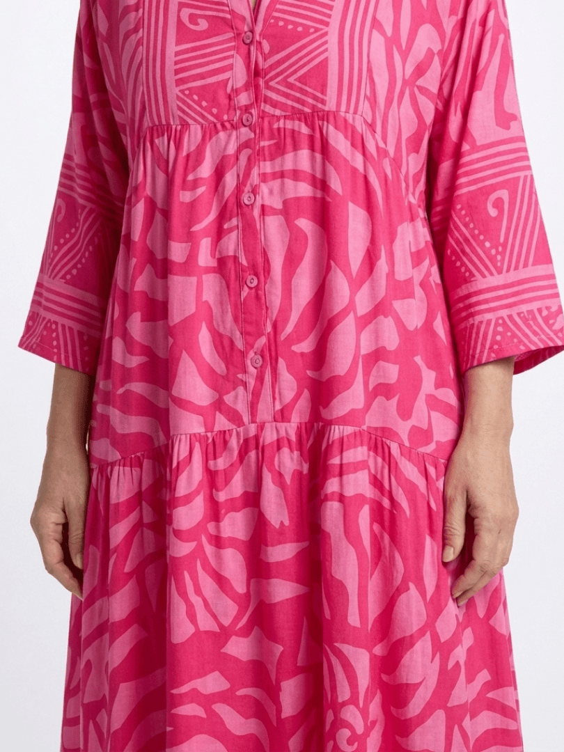 Marielle™ button-front midi dress by Emma & Rose Cape Town, showcasing a stylish, flowy design with a fitted waist and button details.
