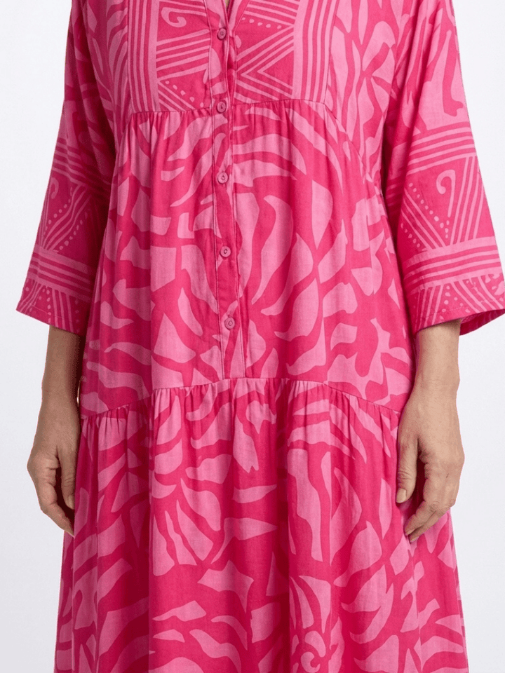 Marielle™ button-front midi dress by Emma & Rose Cape Town, showcasing a stylish, flowy design with a fitted waist and button details.