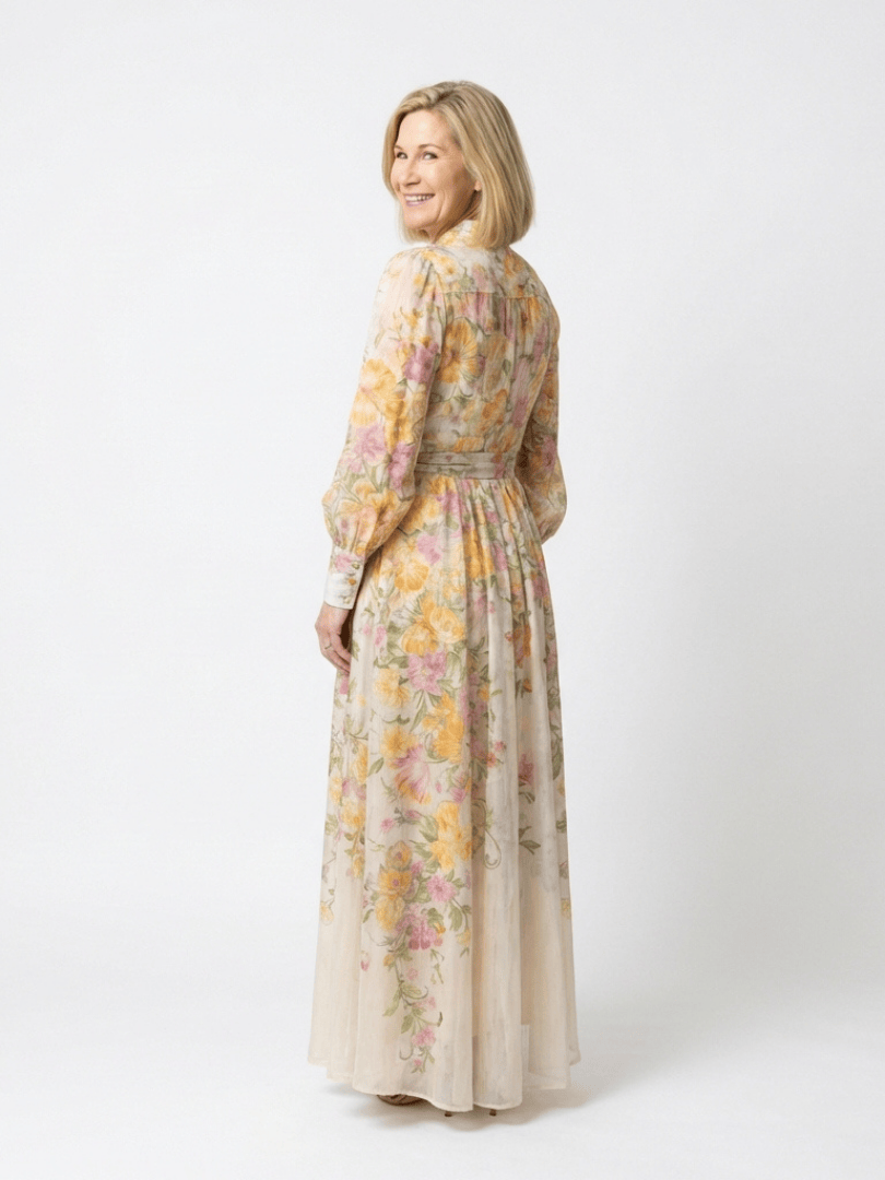 Emma & Rose Cape Town Cressida™ floral sheer long dress displayed on a model with flowing fabric and intricate floral patterns.