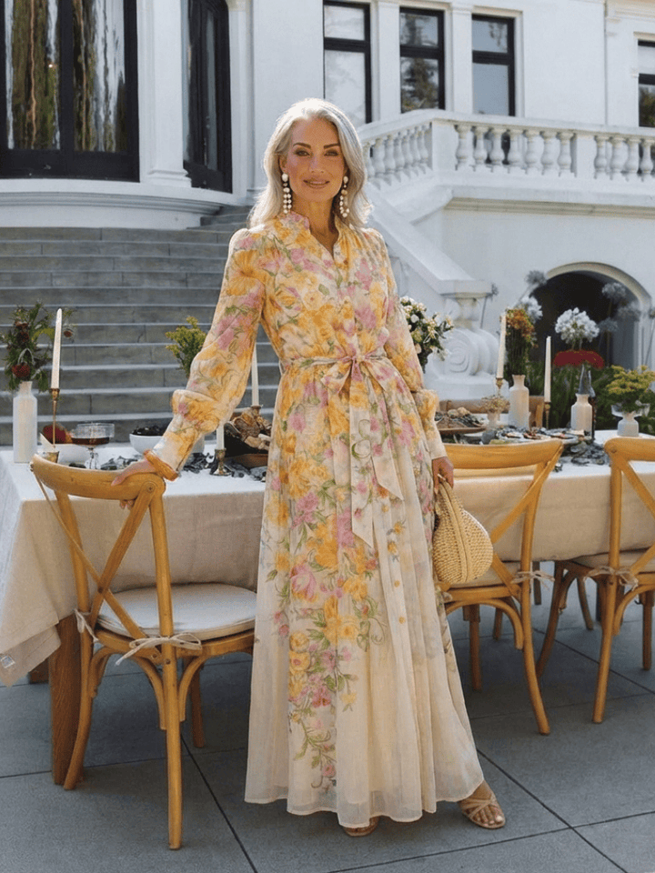 Elegant floral sheer long dress from Emma & Rose Cape Town featuring intricate lace details and flowing fabric.
