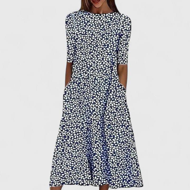 Elegant Sarah™ midi dress by Emma & Rose Cape Town, featuring a flowing fabric and stylish design, shown on a model.